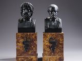 a pair of bronze busts of a man and a woman