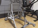 a gym equipment sitting on a wooden floor in a room