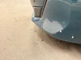 a close up of a car with a denting on it
