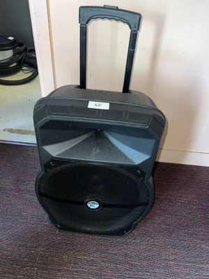 a speaker that is sitting on the floor next to a door