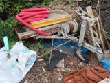 a pile of junk in the yard next to a fire hydrant