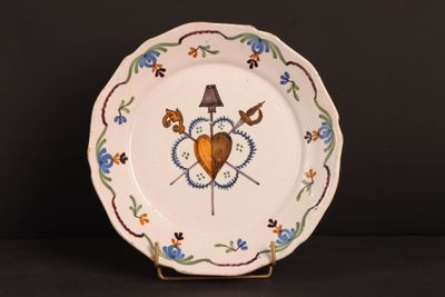 a white plate with a heart and two birds on it