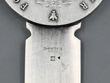 a close up of a knife on a gray surface