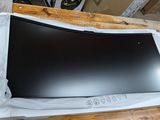 a black television sitting on top of a wooden table