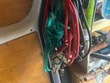 a bunch of hoses that are hanging on the side of a van