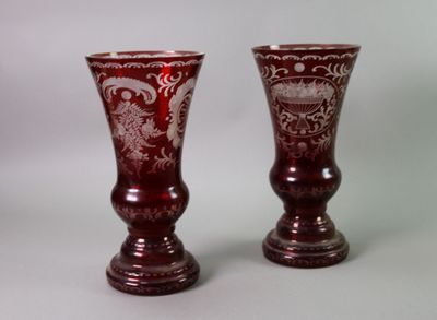 two vases that are sitting next to each other on a table