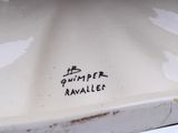 a close up of a white plate with writing on it