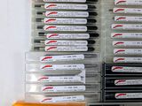 a lot of pens that are sitting on a table
