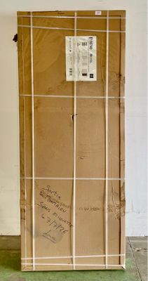 a large cardboard box with a sign on it in a room