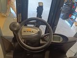 a close up of a forklift in a warehouse