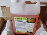 a container of orange juice sitting in a cardboard box