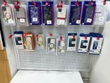 a display of cell phones on the wall in a store