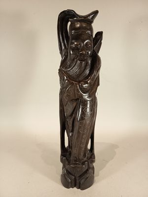 statue of a man with a long beard and a hat on his head