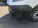 a white van that is parked in a parking lot