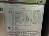a picture of a close up of a sign on a refrigerator