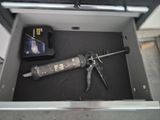 a tool that is sitting inside of a metal box