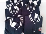 three men ' s baseball uniforms are lined up on a white surface