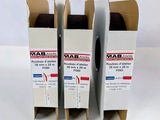 three boxes of wax on a white surface with a white background