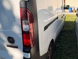 a white van that is parked in the grass
