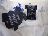 a label on the bottom of a white shirt with a blue turtle on it