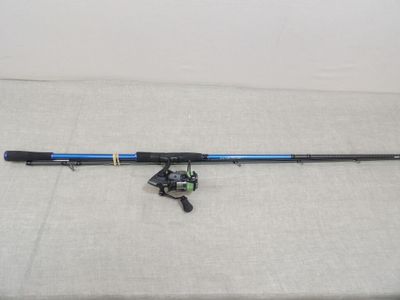 a fishing rod and reel sitting on top of a table