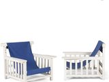 pair of white wooden chairs with blue cushions and a blue blanket