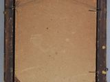an old picture frame with a piece of paper hanging from it ' s side