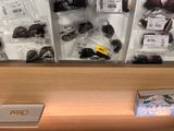 many pairs of sunglasses on display in a store