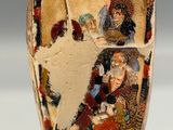 a vase with a picture of a man and a woman on it