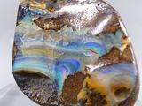 a close up of a rock with a blue and yellow pattern on it