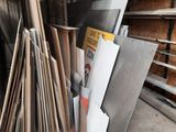 a pile of wood and metal in a warehouse