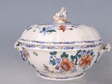 a large bowl with a lid that has flowers on it