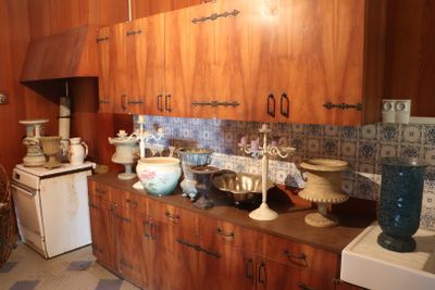 many vases on the counter in this kitchen