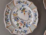 many plates that are sitting on a table