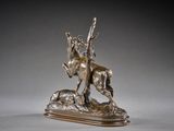 bronze sculpture of a man on a horse on a rock