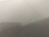 a picture of a dirty bathroom with a lot of water on the ceiling