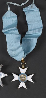two medals and a star on a blue ribbon