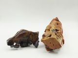 pair of carved figurines of a bear and a bear cub