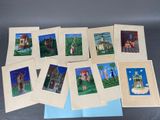 six cartes représentant des maisons, posées sur une table