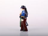 a figurine of a man with a hat and a coat