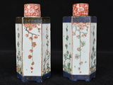 pair of chinese porcelain vases with flowers and birds on them