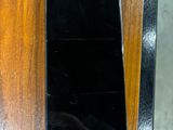 a cell phone that is sitting on a wooden table