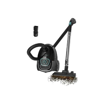 the black and silver vacuum is next to a duster and a brush