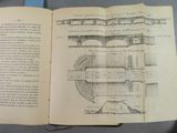 an open book with a drawing of a bridge on it