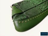 a green purse with a snake skin pattern on it