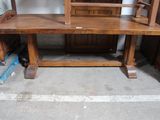 a wooden desk with a mirror on top of it