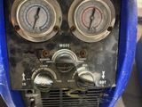 two gauges on the back of a blue motorcycle