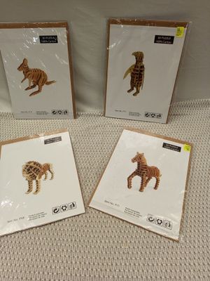 three cards with a picture of a zebra and a giraffe on them