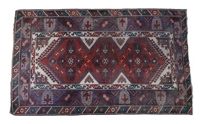 a red and blue rug on a white background