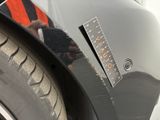 a close up of a car ' s bumper with a sticker on it
